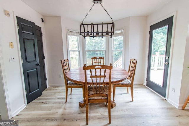 4222 Honey Creek Way, Powder Springs, GA 30127 - dining area featuring a chandelier and light wood-style floors