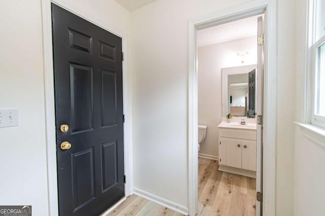 4222 Honey Creek Way, Powder Springs, GA 30127 - foyer entrance featuring light wood finished floors and a textured ceiling