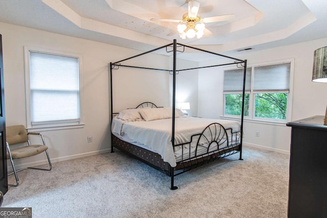 4222 Honey Creek Way, Powder Springs, GA 30127 - carpeted bedroom featuring a raised ceiling and a ceiling fan