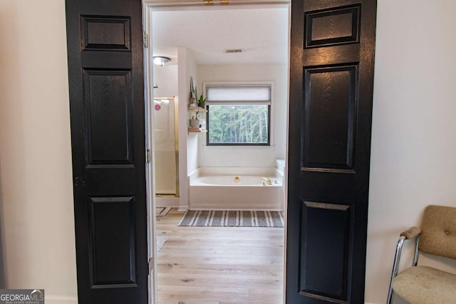 4222 Honey Creek Way, Powder Springs, GA 30127 - full bath featuring wood finished floors and a garden tub