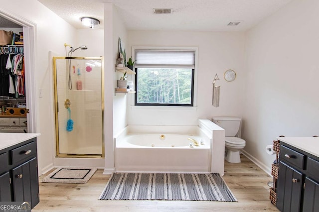 4222 Honey Creek Way, Powder Springs, GA 30127 - full bathroom featuring vanity, a whirlpool tub, wood finished floors, and a stall shower