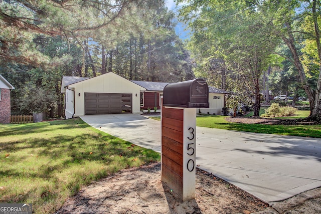 view of front of property with a garage and a front yard