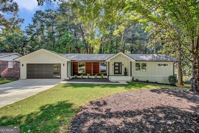 ranch-style house with a garage and a front lawn