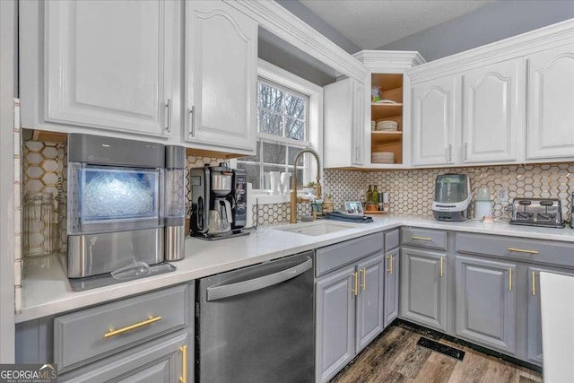 kitchen with gray cabinets, tasteful backsplash, sink, white cabinets, and stainless steel dishwasher