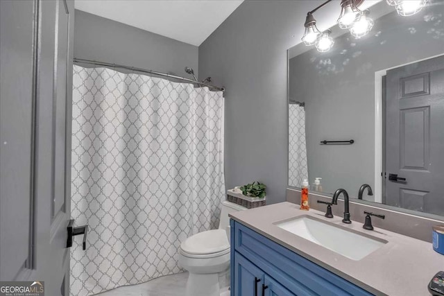 bathroom with vanity and toilet