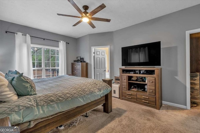 bedroom featuring a textured ceiling, ceiling fan, and carpet flooring