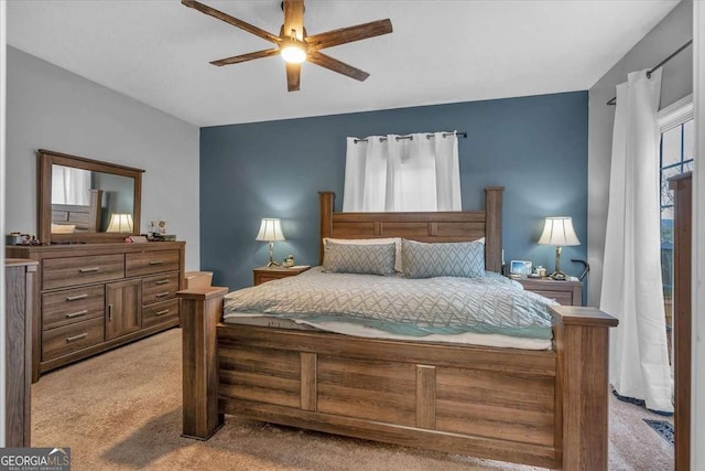 carpeted bedroom featuring ceiling fan