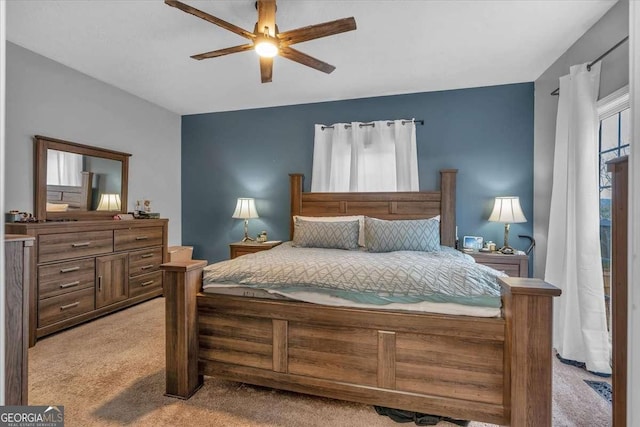 bedroom featuring ceiling fan and light colored carpet