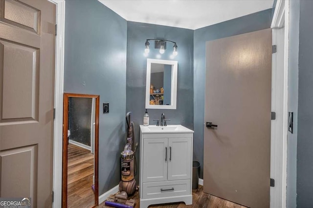 bathroom with vanity and wood-type flooring