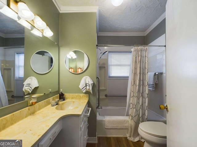 full bathroom featuring ornamental molding, toilet, shower / bath combo with shower curtain, and vanity