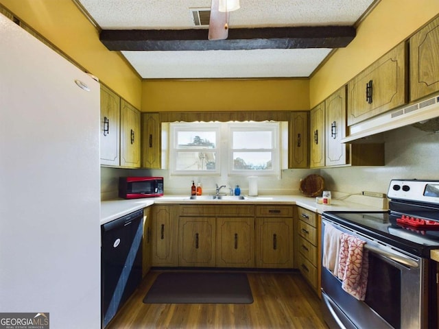 kitchen featuring sink, electric range, beamed ceiling, and a textured ceiling