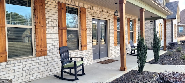 view of exterior entry with a porch