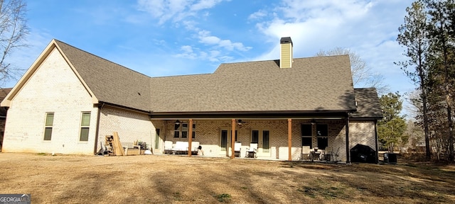 rear view of house featuring cooling unit, ceiling fan, and a patio