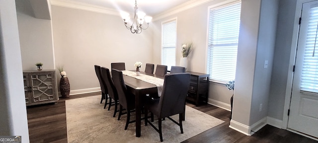 dining room with crown molding, dark wood-type flooring, and a chandelier