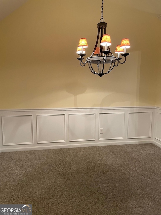 interior details featuring carpet and a notable chandelier