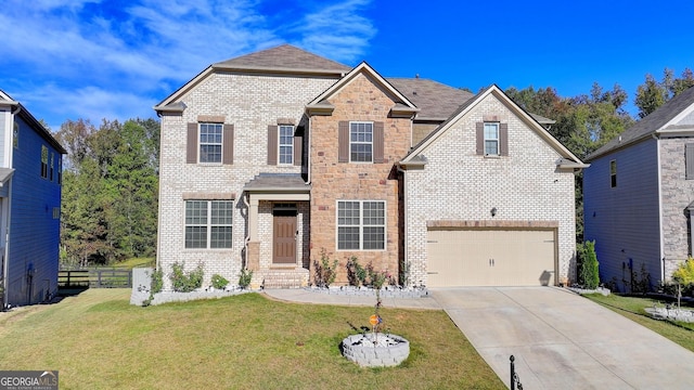 view of front of home with a garage and a front lawn