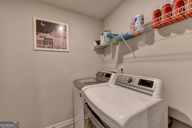 clothes washing area featuring independent washer and dryer