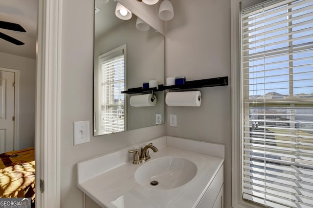 bathroom featuring ceiling fan and vanity