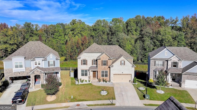 view of front of house featuring a garage and a front yard