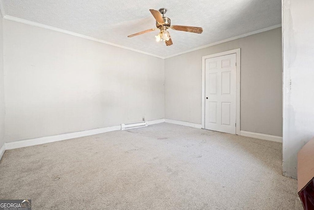 carpeted empty room with ceiling fan, crown molding, and a textured ceiling