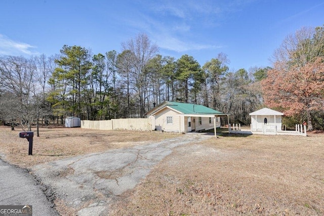 exterior space with a gazebo and a storage shed