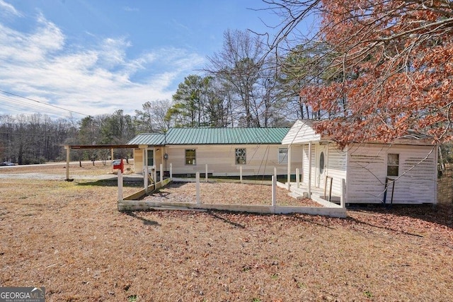 rear view of house with a carport