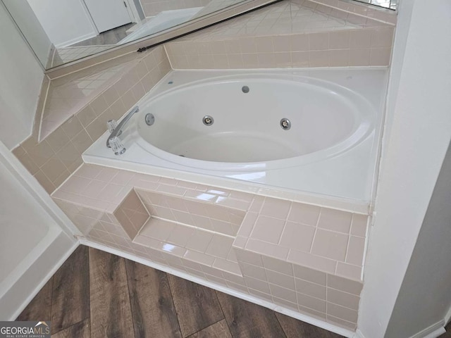 bathroom with tiled bath