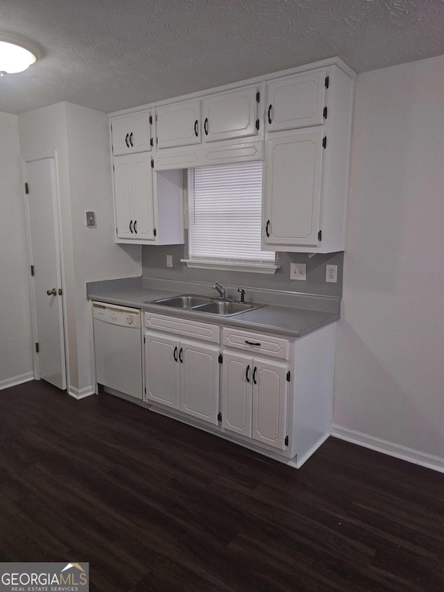 kitchen with dark hardwood / wood-style floors, dishwasher, sink, and white cabinets