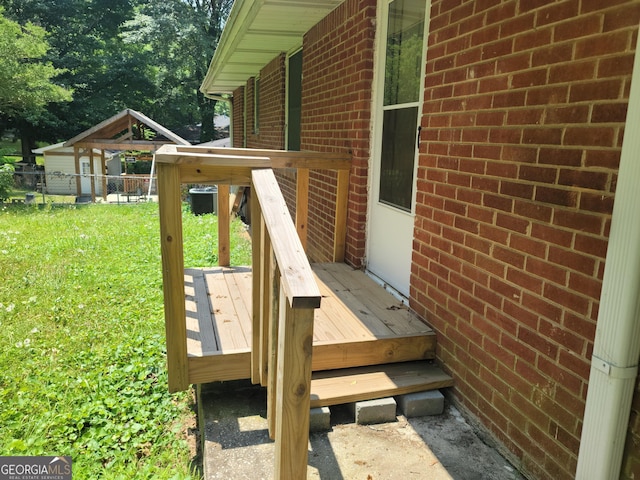 wooden terrace with a yard