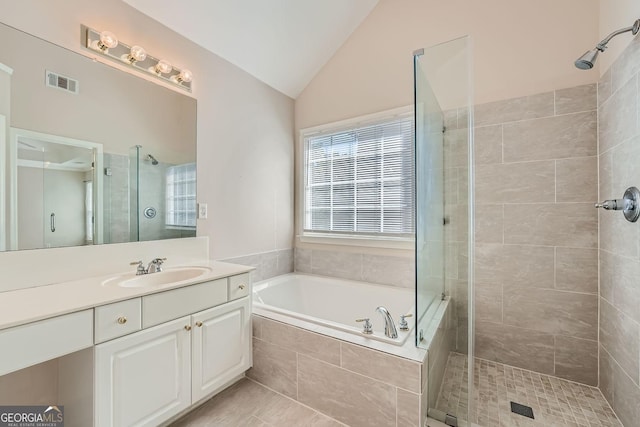 bathroom with lofted ceiling, plus walk in shower, and vanity