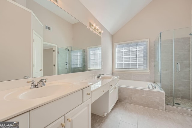 bathroom with lofted ceiling, vanity, tile patterned flooring, and separate shower and tub