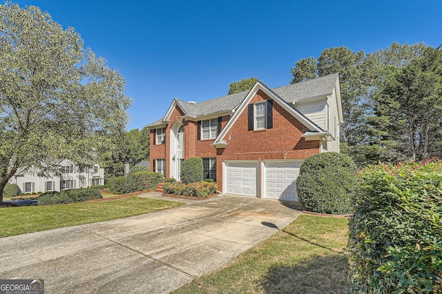 view of front of home featuring a garage and a front yard