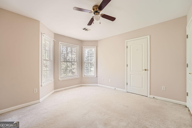 carpeted empty room with ceiling fan