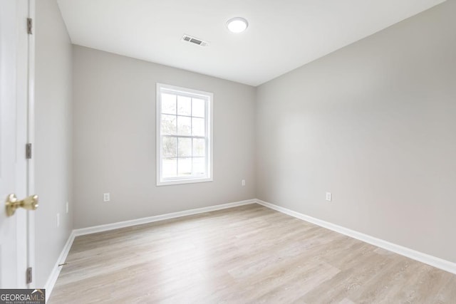 unfurnished room featuring light hardwood / wood-style flooring