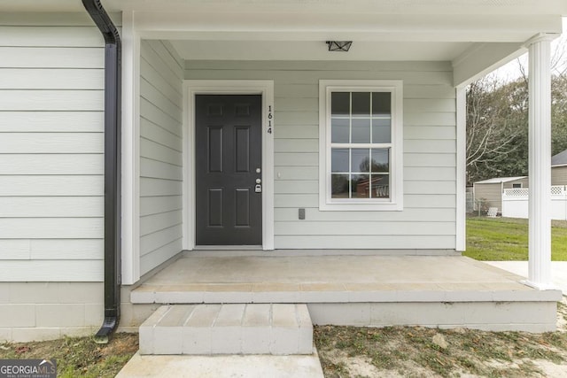 property entrance featuring a porch