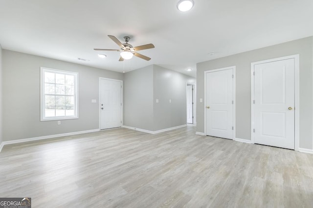 empty room featuring light hardwood / wood-style floors and ceiling fan