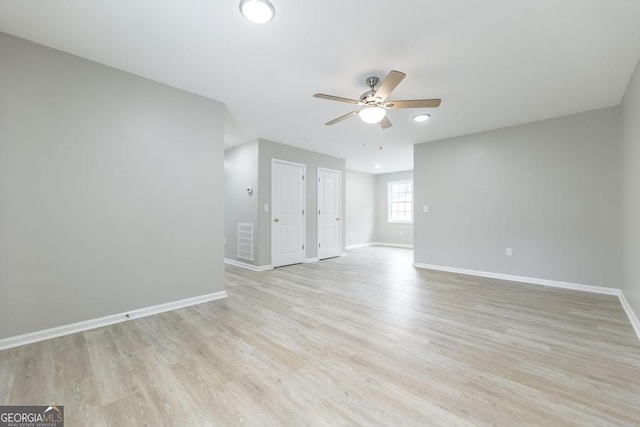 unfurnished room featuring ceiling fan and light hardwood / wood-style flooring