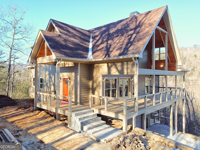 view of front of house with a garage and a wooden deck