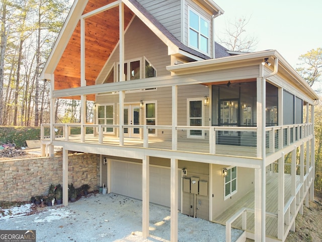 rear view of house with a garage