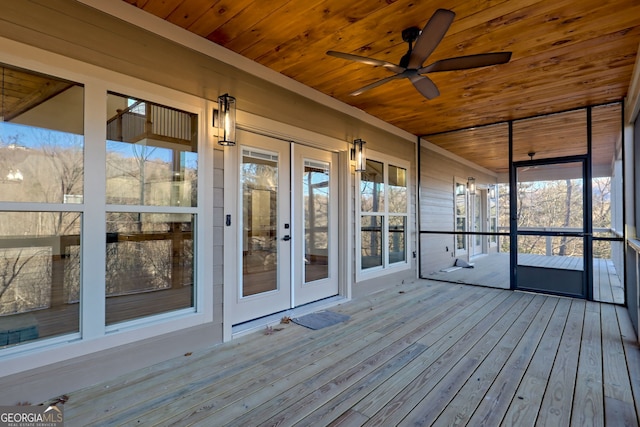 unfurnished sunroom with french doors, ceiling fan, and wooden ceiling