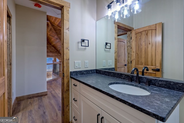 bathroom with vanity and wood-type flooring