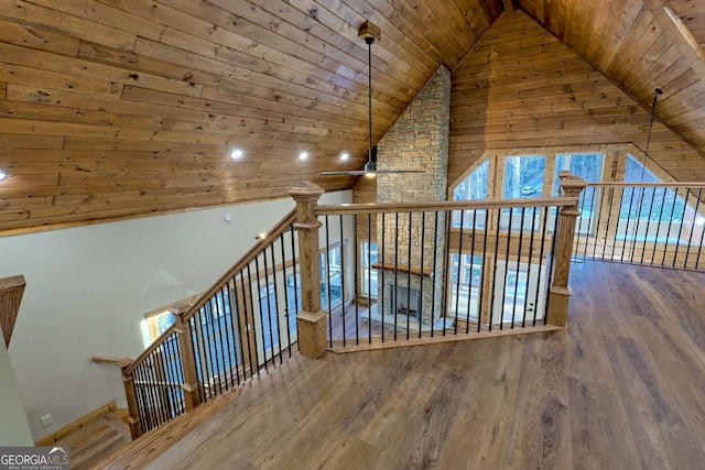 additional living space with wood ceiling, ceiling fan, high vaulted ceiling, and hardwood / wood-style floors