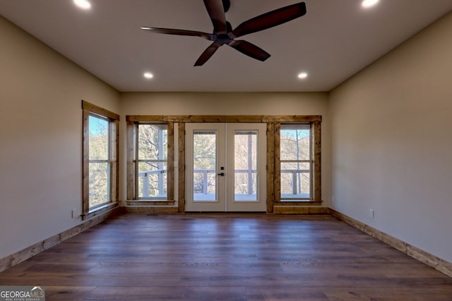 interior space with ceiling fan, dark hardwood / wood-style flooring, and french doors