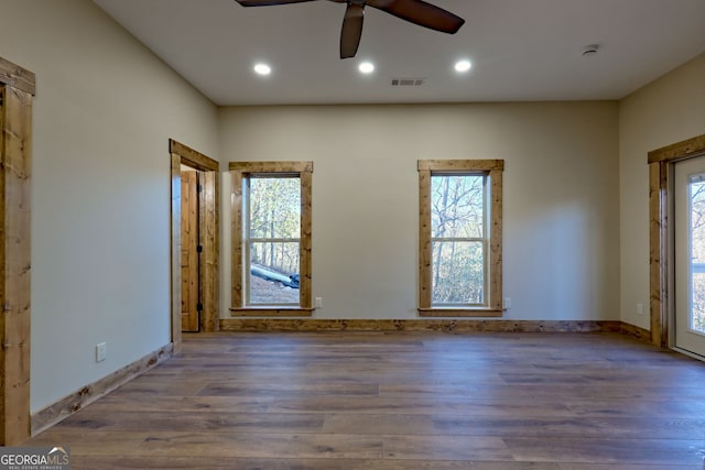 entrance foyer with ceiling fan and wood-type flooring