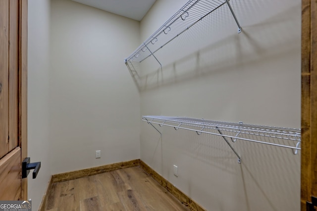 walk in closet featuring wood-type flooring