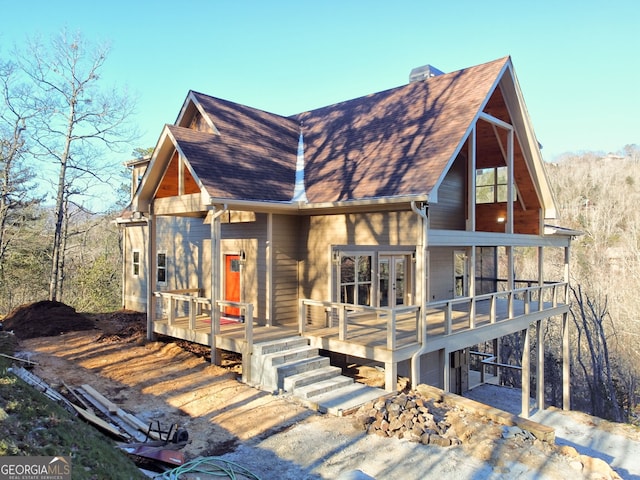 view of front of home with a garage and a deck