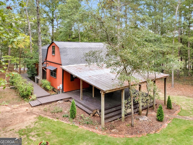 view of outbuilding with a yard