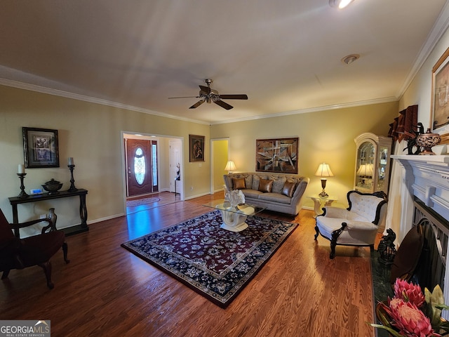 living room featuring hardwood / wood-style flooring, ornamental molding, and ceiling fan