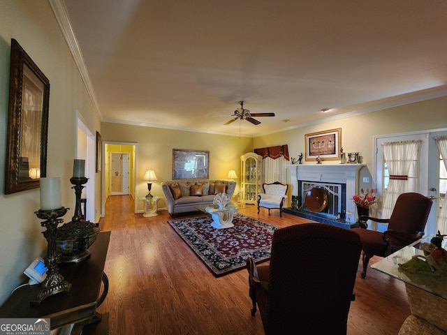 living room featuring french doors, ornamental molding, and wood-type flooring