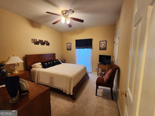 bedroom featuring light carpet and ceiling fan